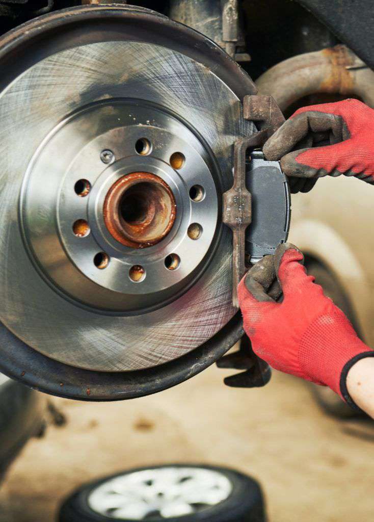 Technician carrying out brake work